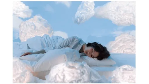 How to tackle sleep issues and Improve Sleep Overcoming sleep issues—woman sleeping on a fluffy cloud and soft pillow. Get tips for better rest.